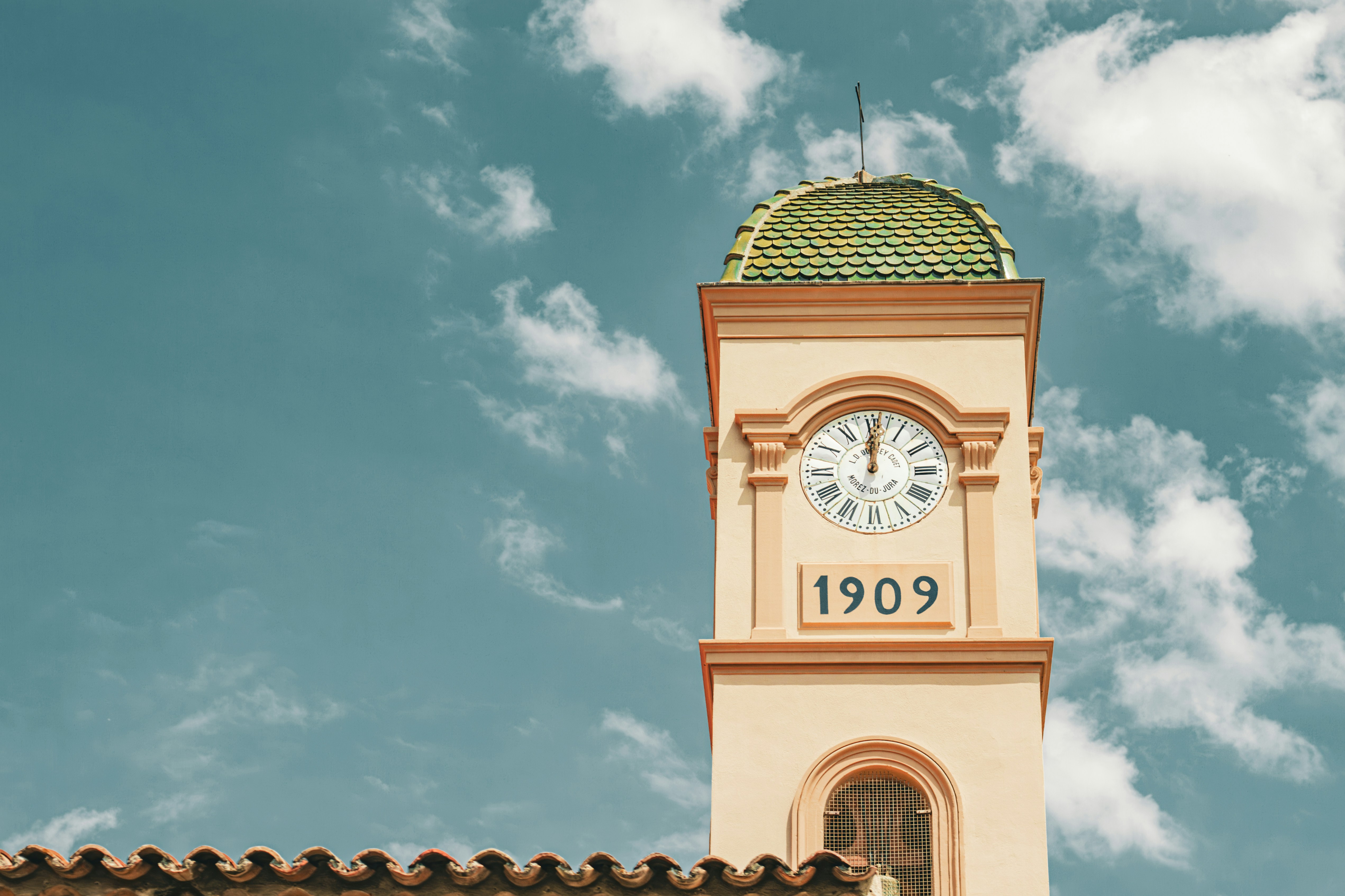 A clock tower with a sky background
