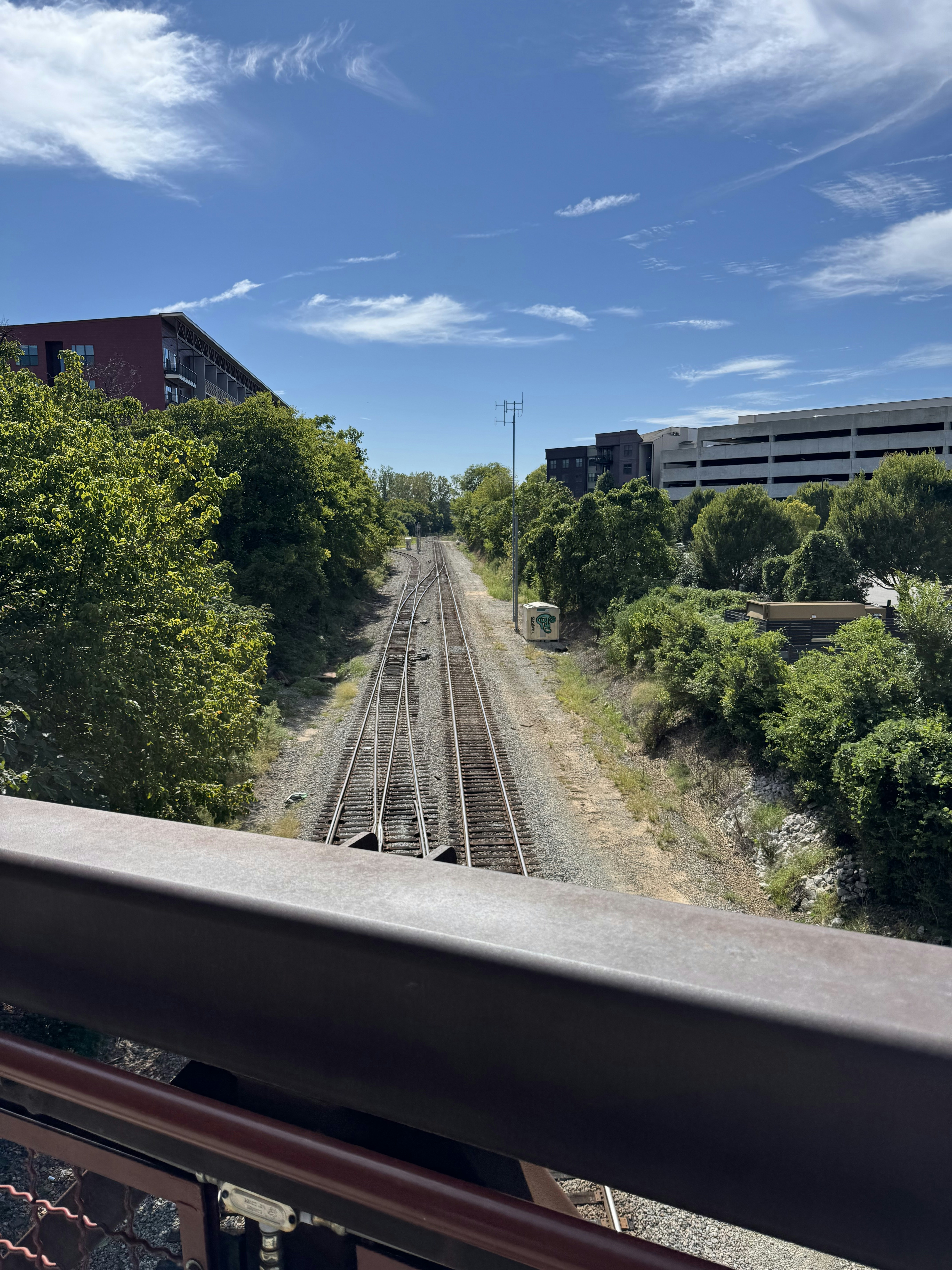 A view of a train track from a balcony