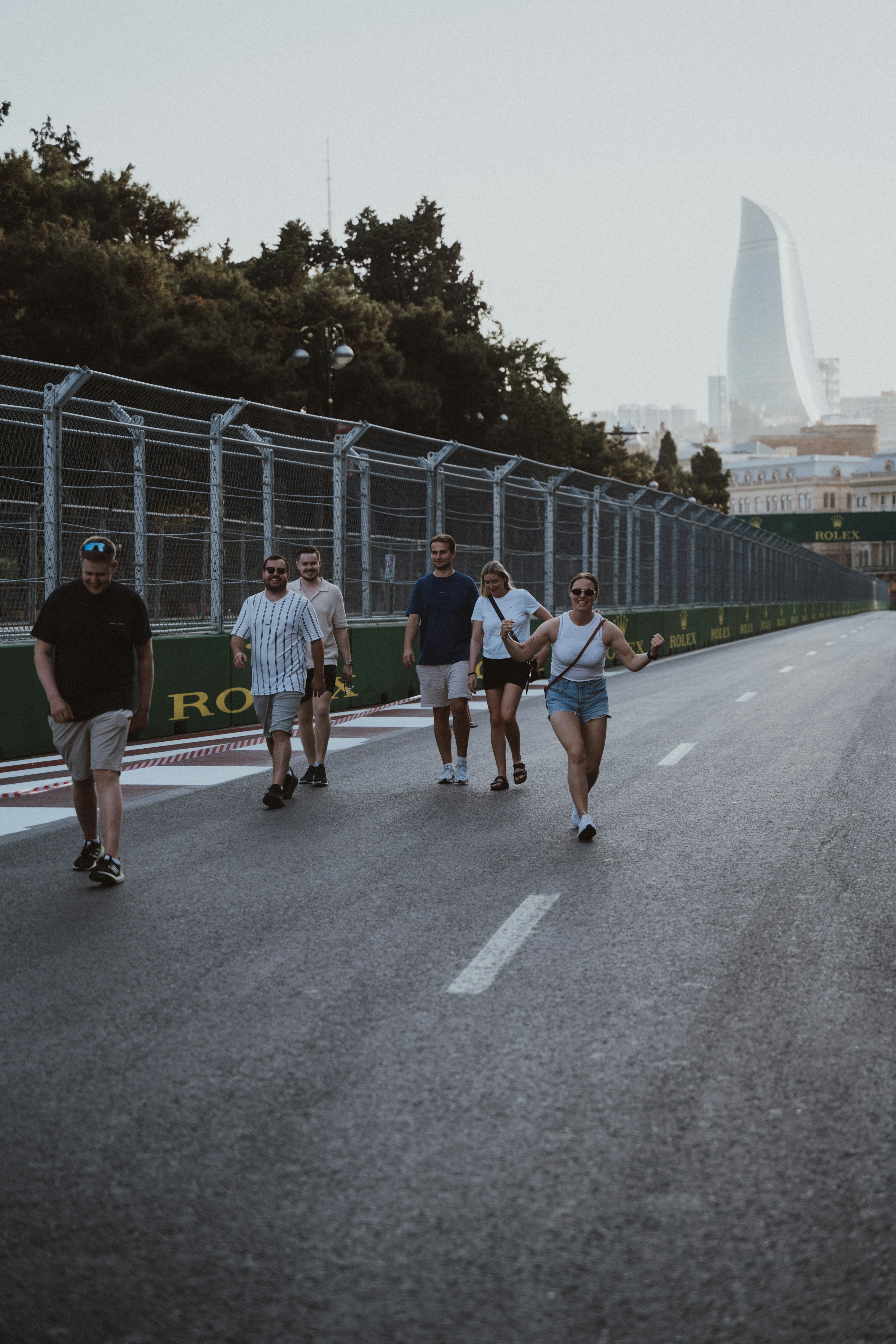 A group of people walking down a street