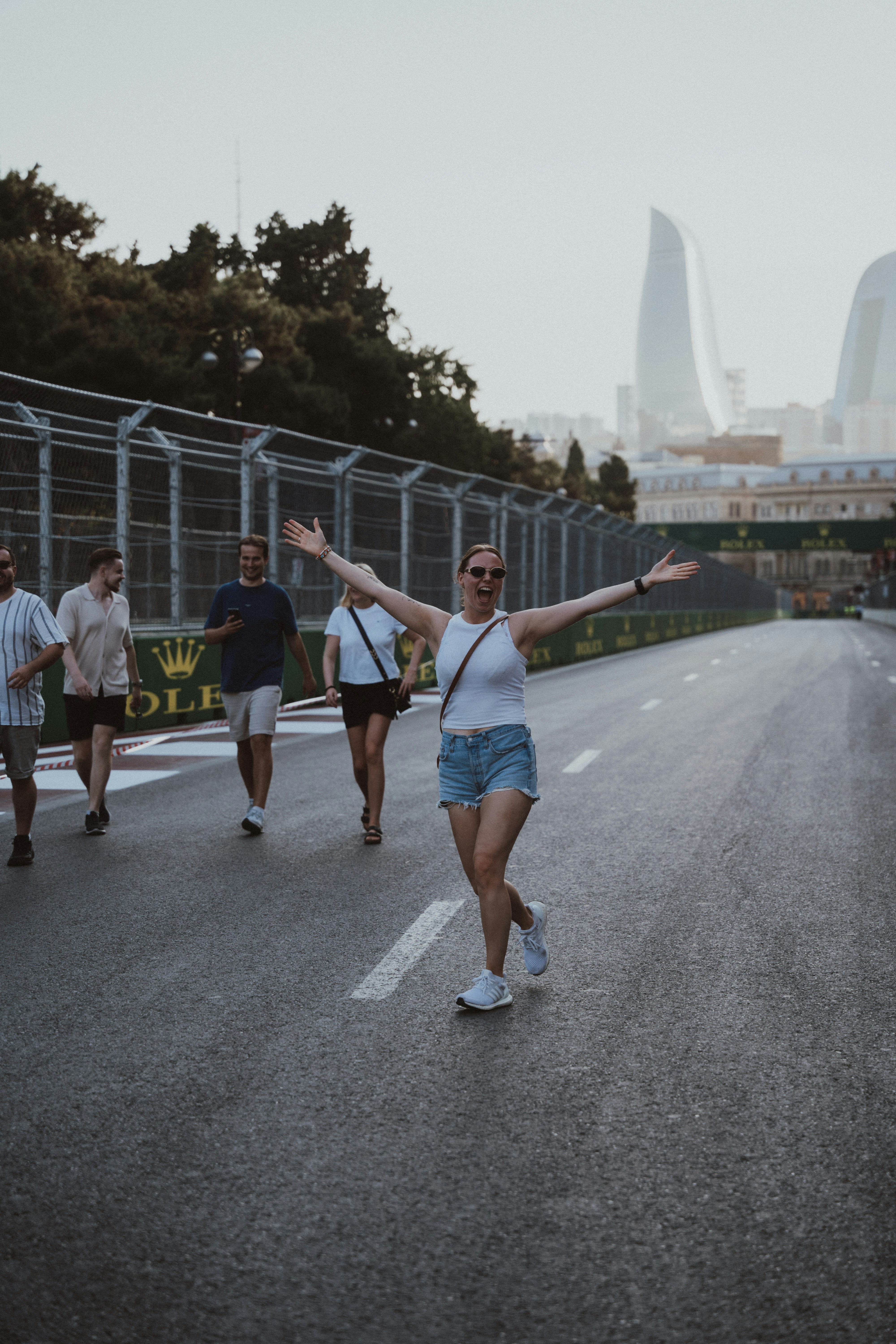 A group of people walking down a street