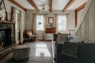 A living room filled with furniture and a fire place