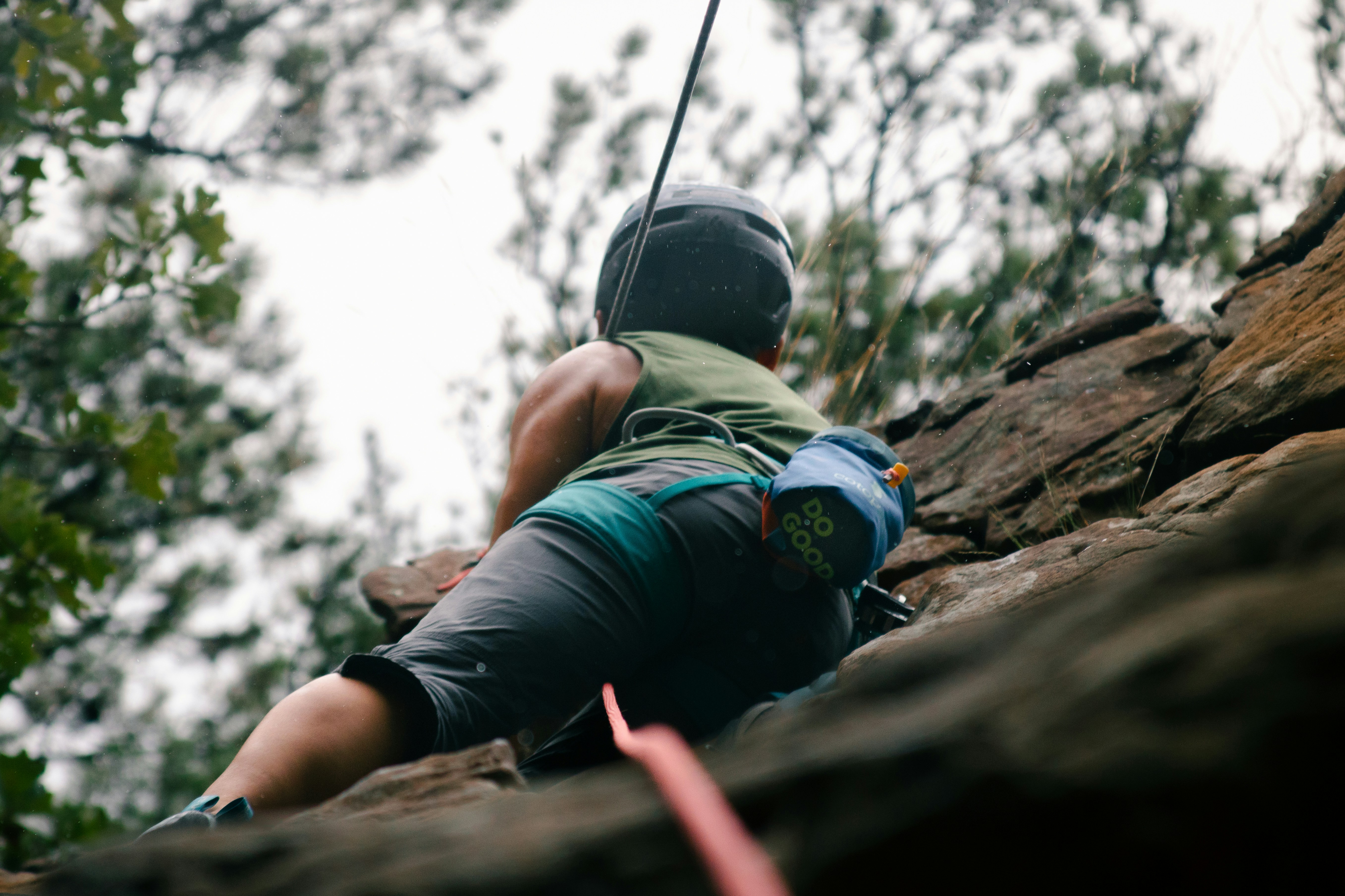 Athletic woman rock climbing