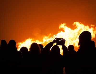 A crowd of people watching a fire show
