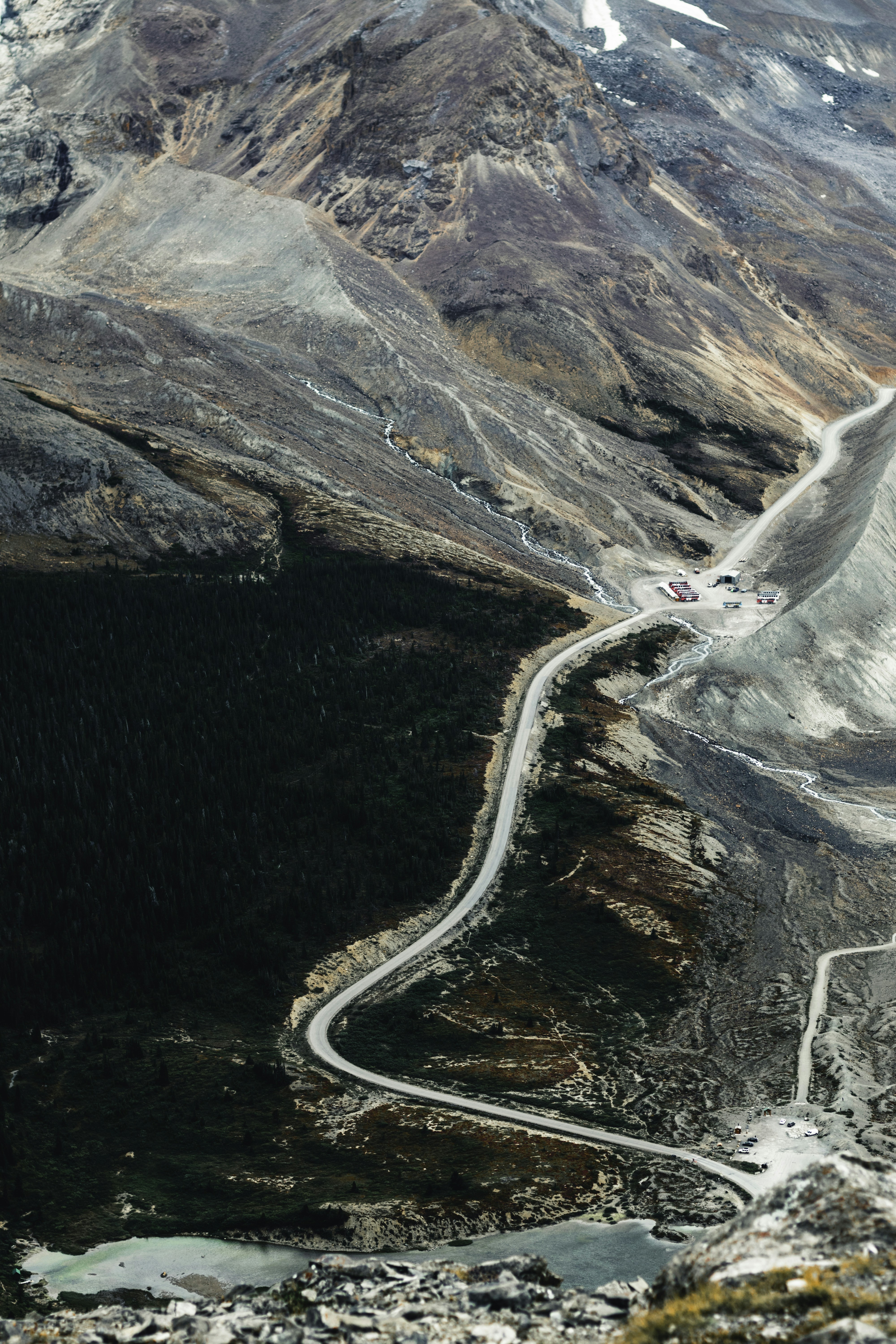 A winding road in the middle of a mountain range
