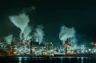 A large factory with lots of smoke coming out of it