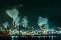 A large factory with lots of smoke coming out of it
