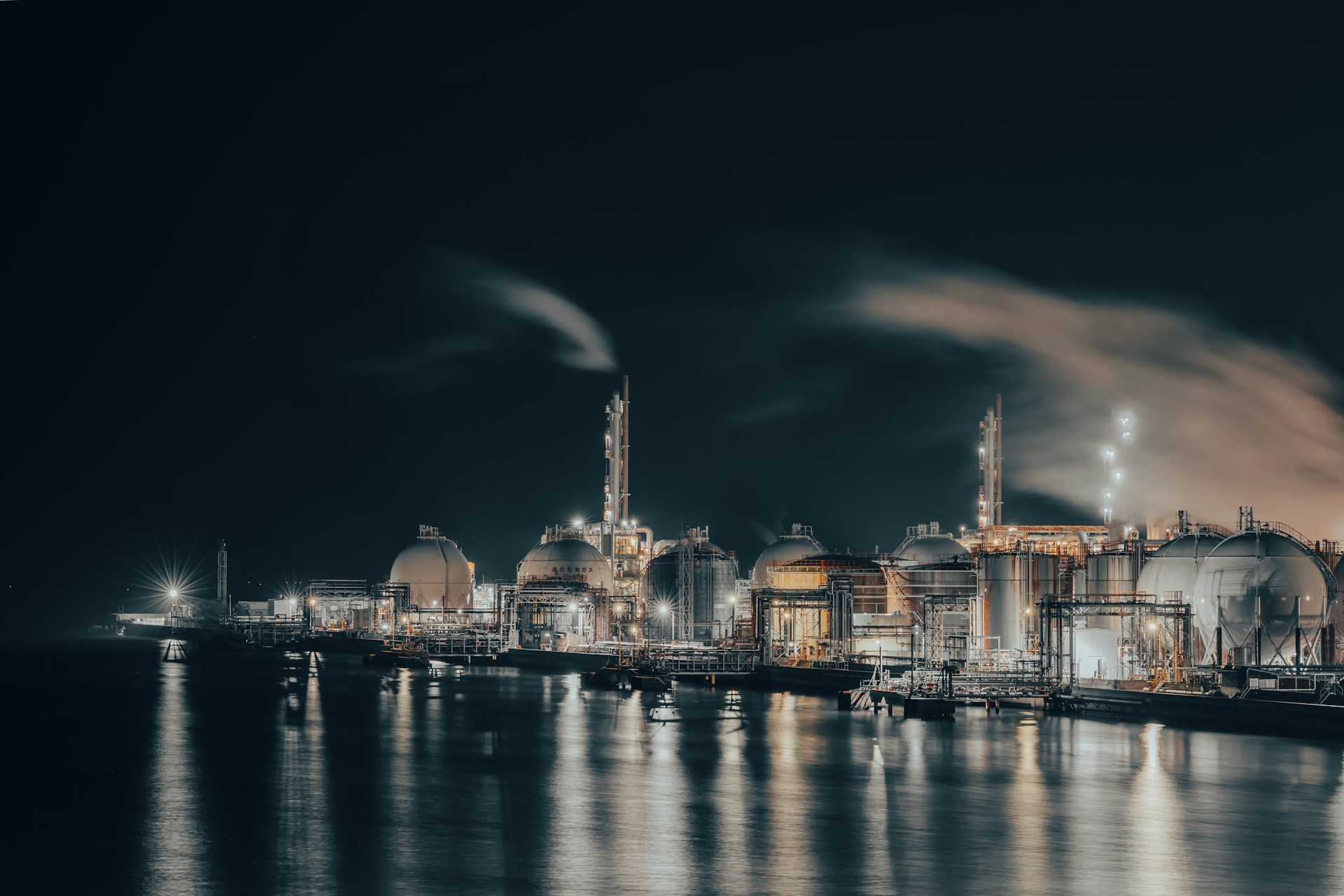 A night scene of a city by the water