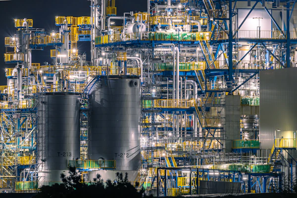 Oil refinery at night, where crude, refined product and produced water samples are collected for lab analysis