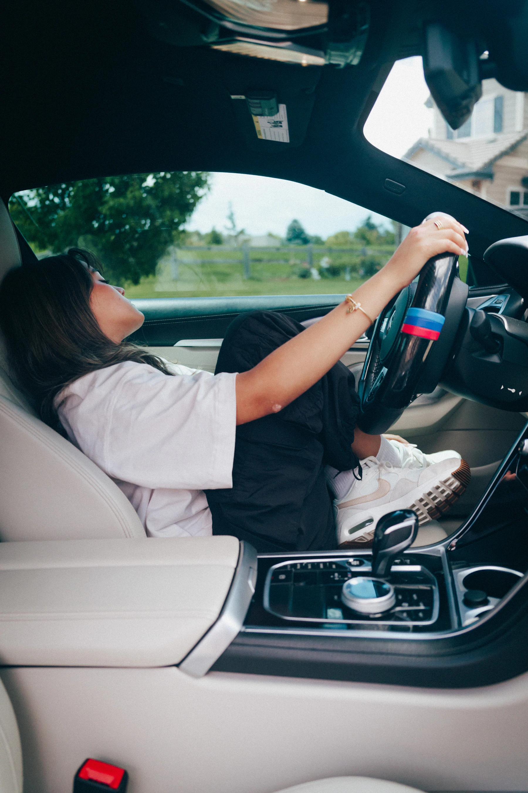 Driver inside a modern vehicle cabin during everyday use