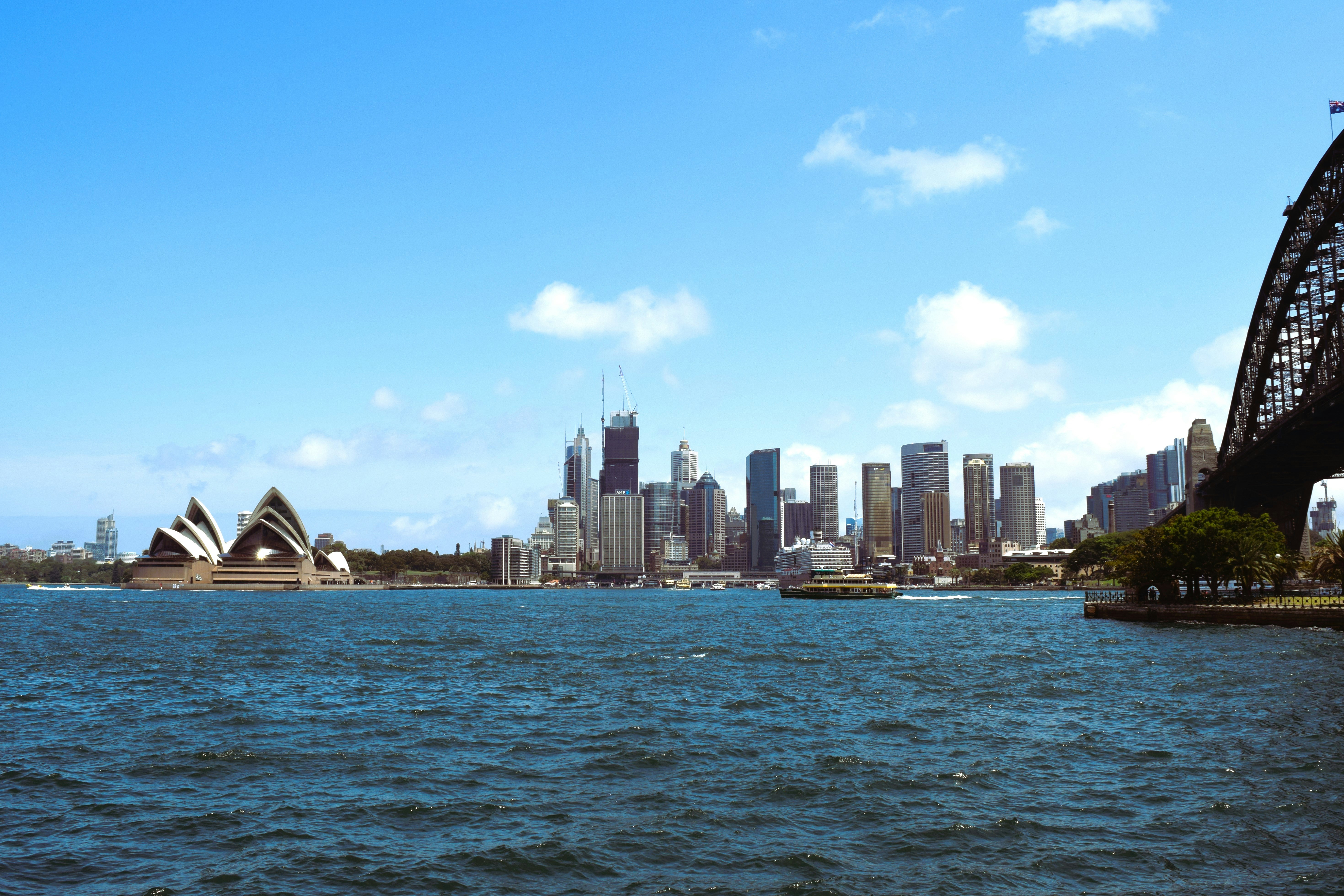 A large body of water with a bridge in the background