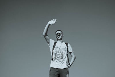 A man standing on top of a hill holding a frisbee