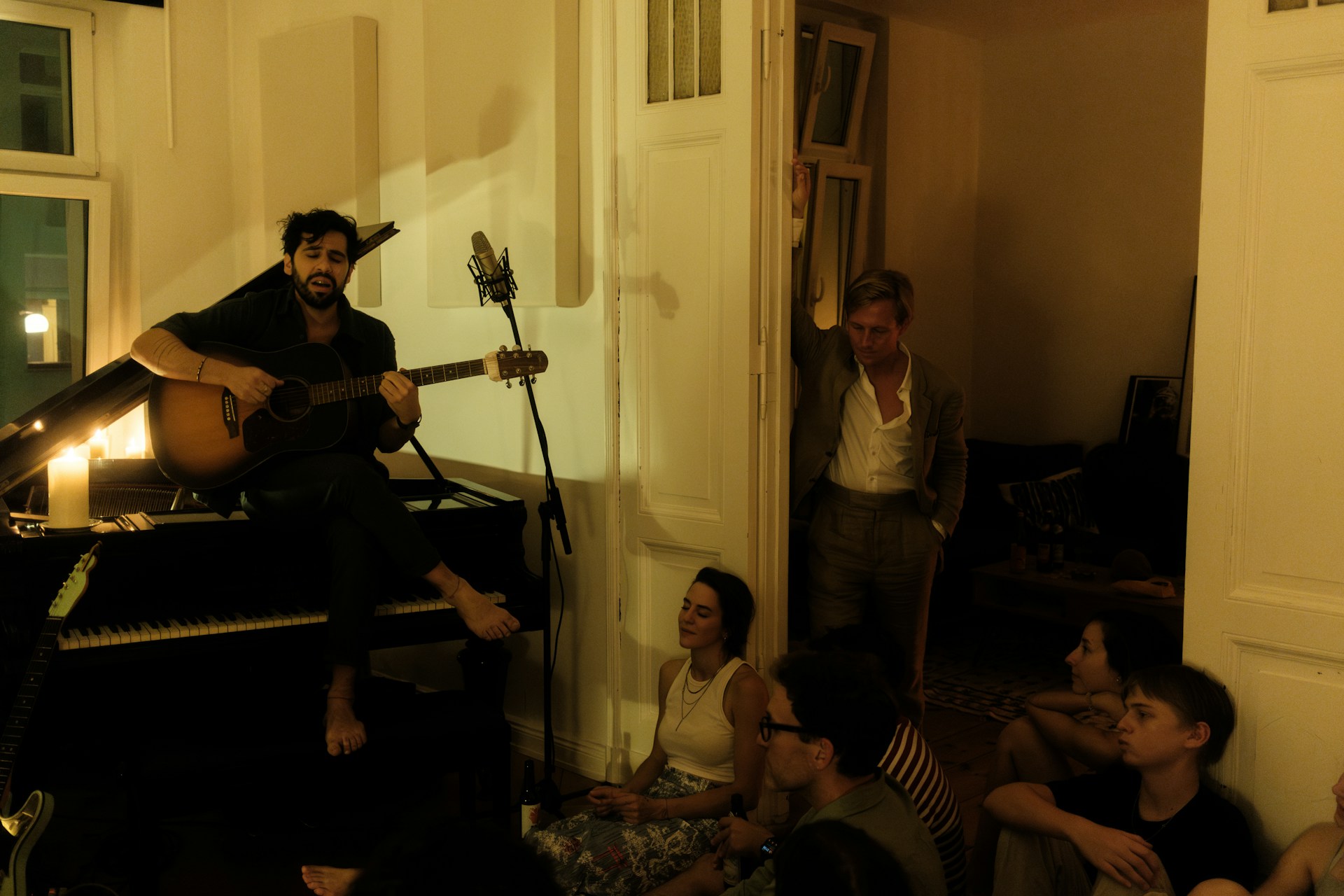 A group of people sitting around a living room