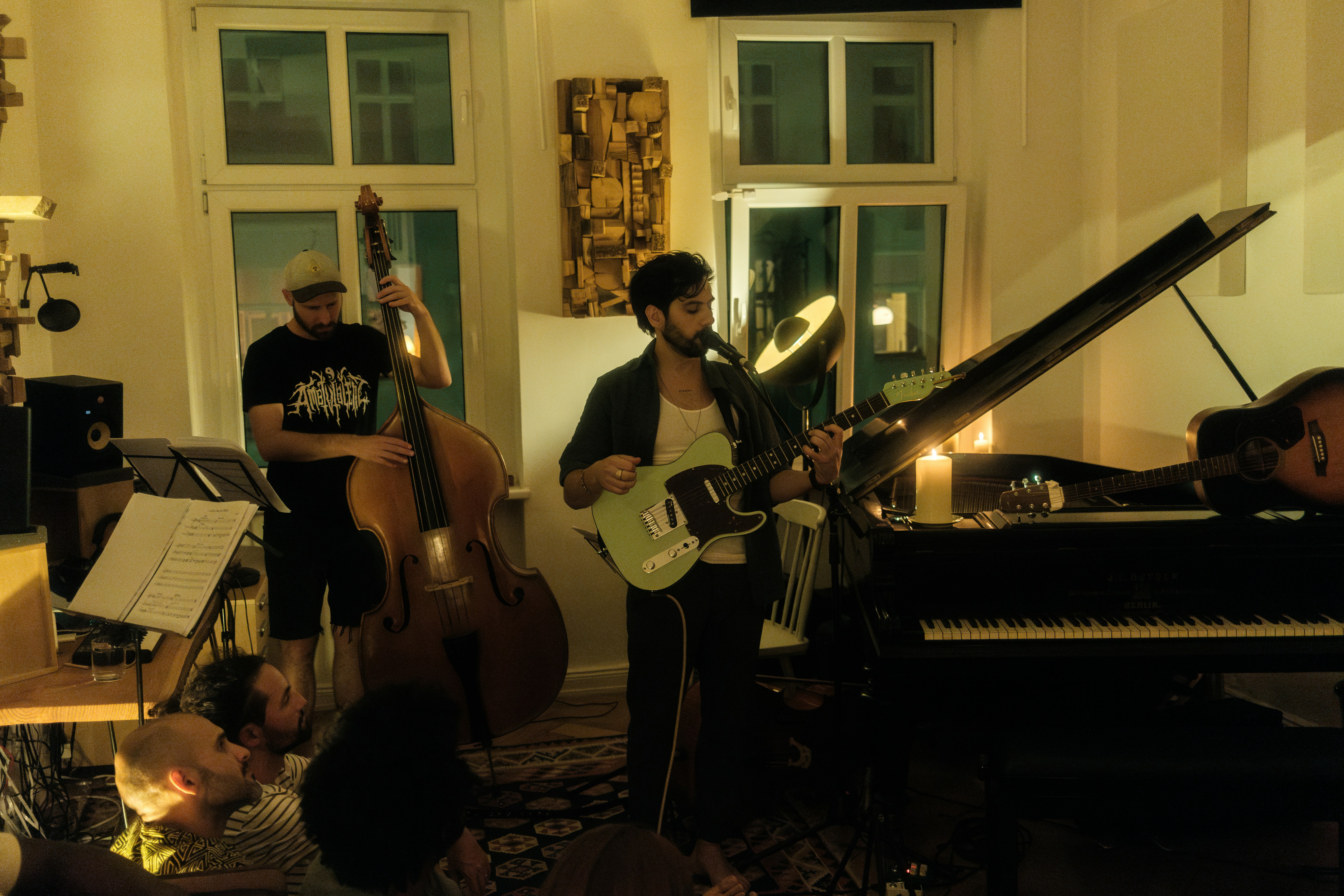 A group of people playing instruments in a room