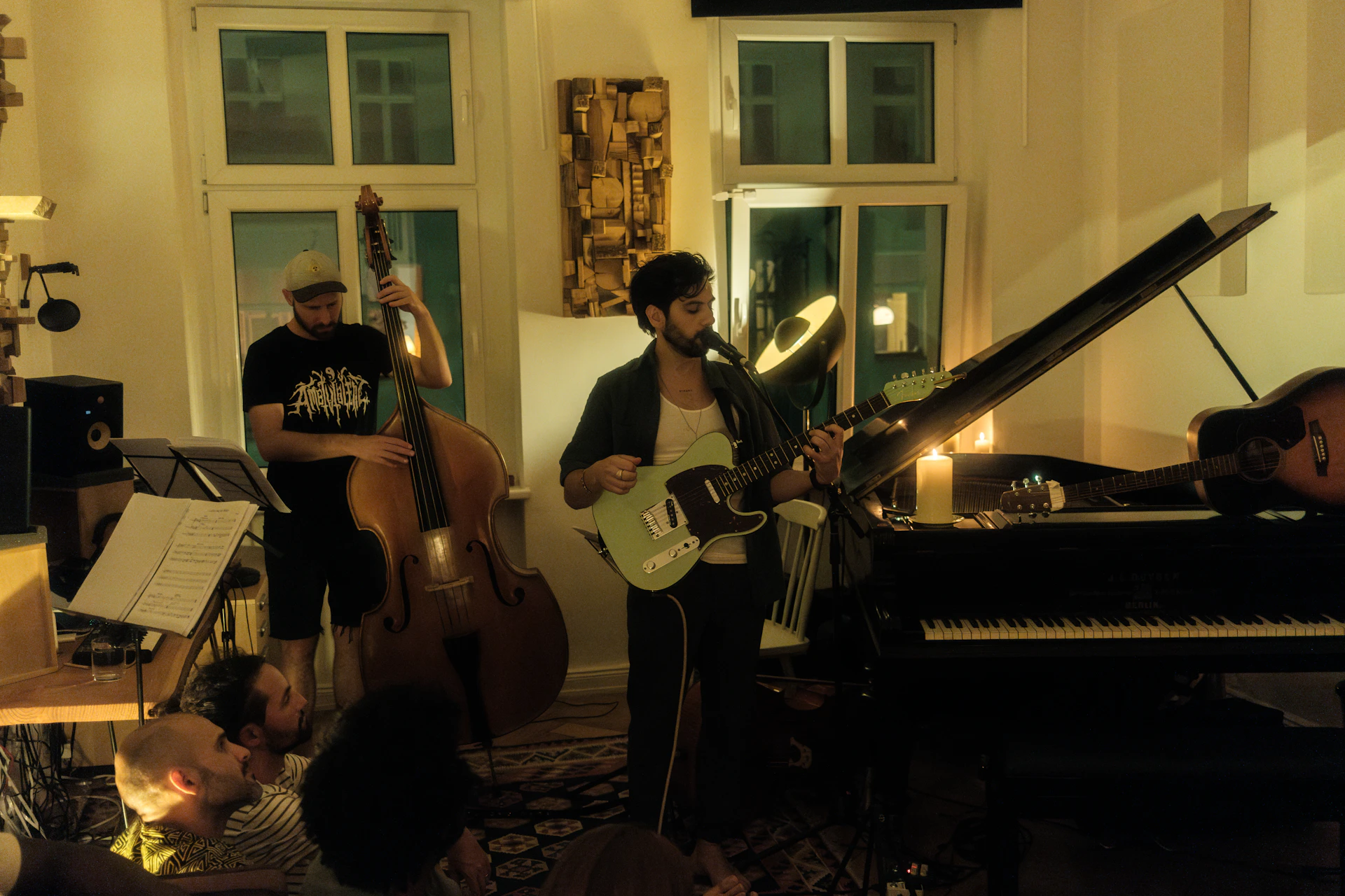 A group of people playing instruments in a room