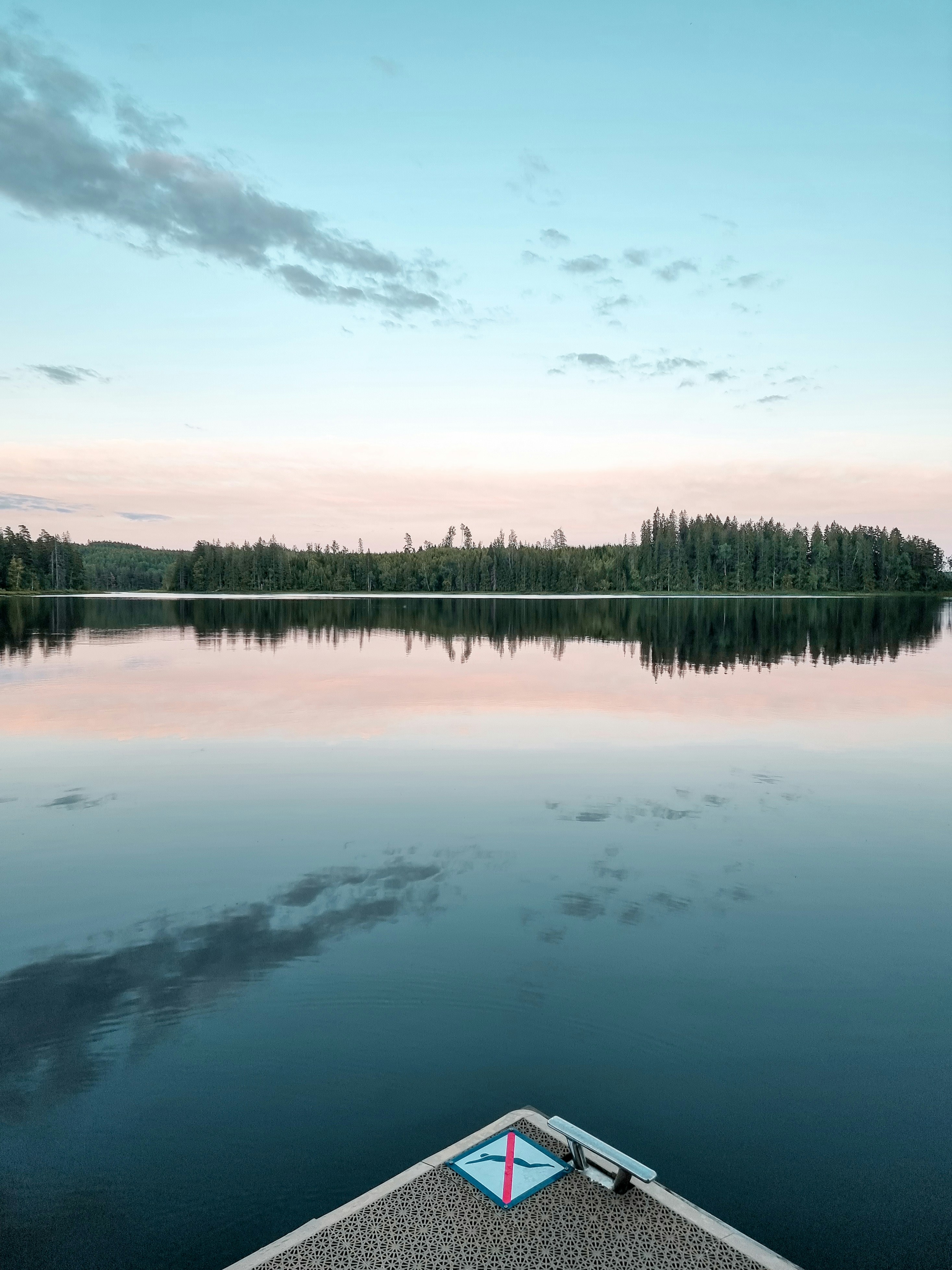A view of a lake from a boat on the water