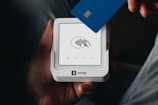 A person holding a credit card in their hand