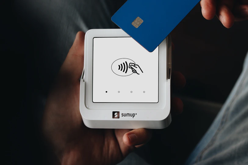 A person holding a credit card in their hand