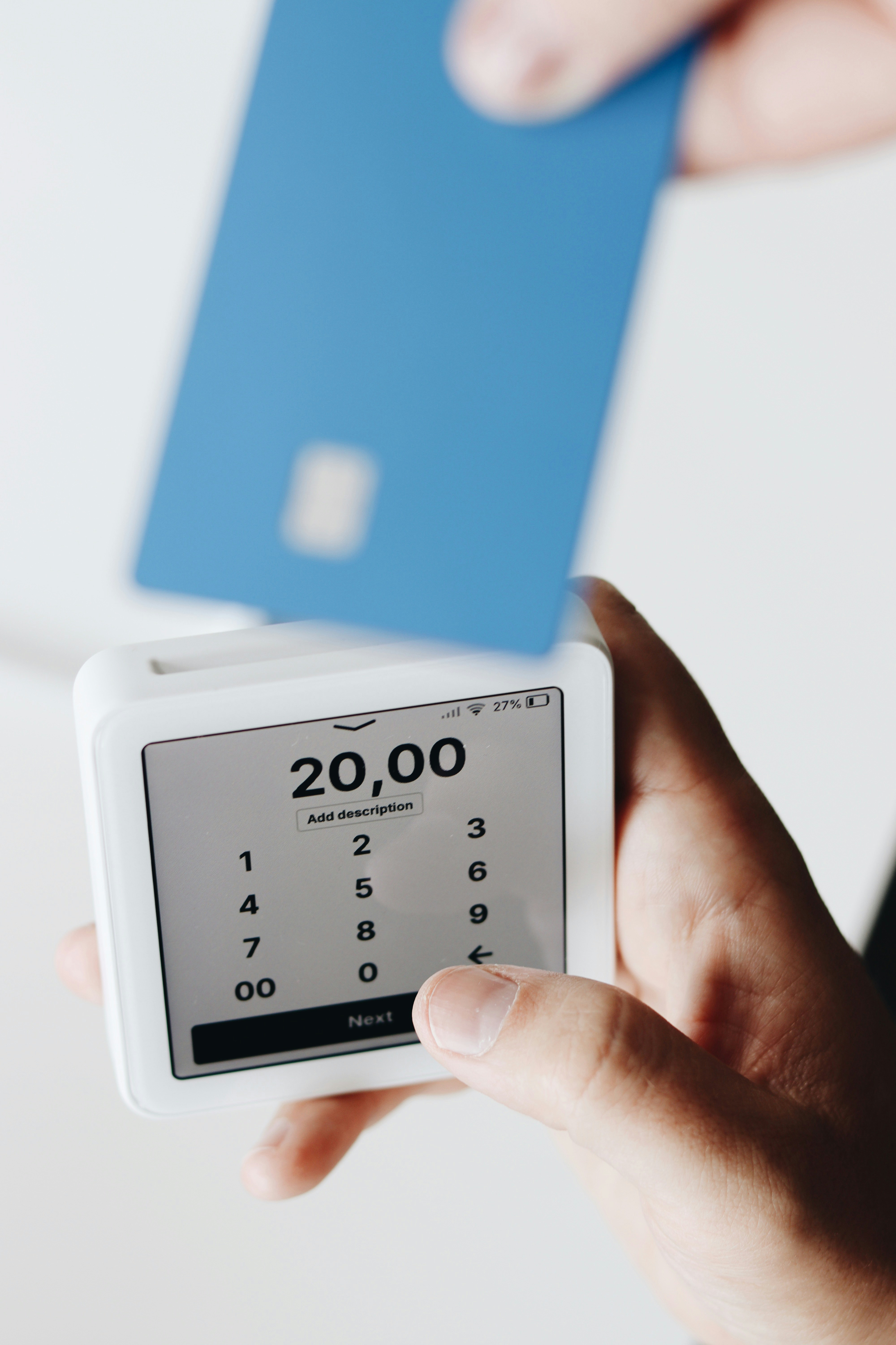 A person holding a cell phone in their hand