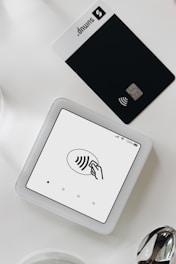 A tablet computer sitting on top of a white table