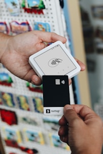 A person holding a smart phone in their hand