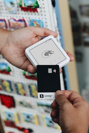 A person holding a smart phone in their hand