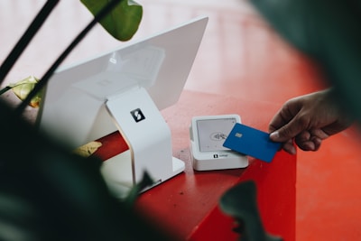 A person opening a box on a table