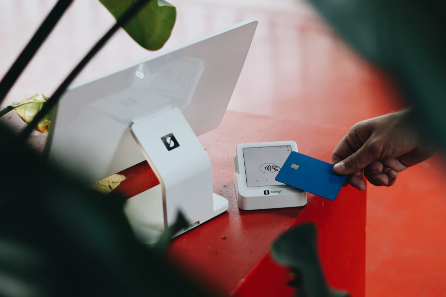 Two people reviewing payment hardware options together at a shop counter