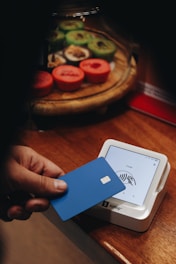 A person holding a credit card in their hand
