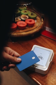 A person holding a credit card in their hand