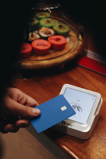 A person holding a credit card in their hand