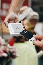 A person holding a cell phone in their hand