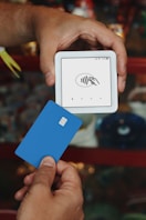A person holding a credit card in their hand