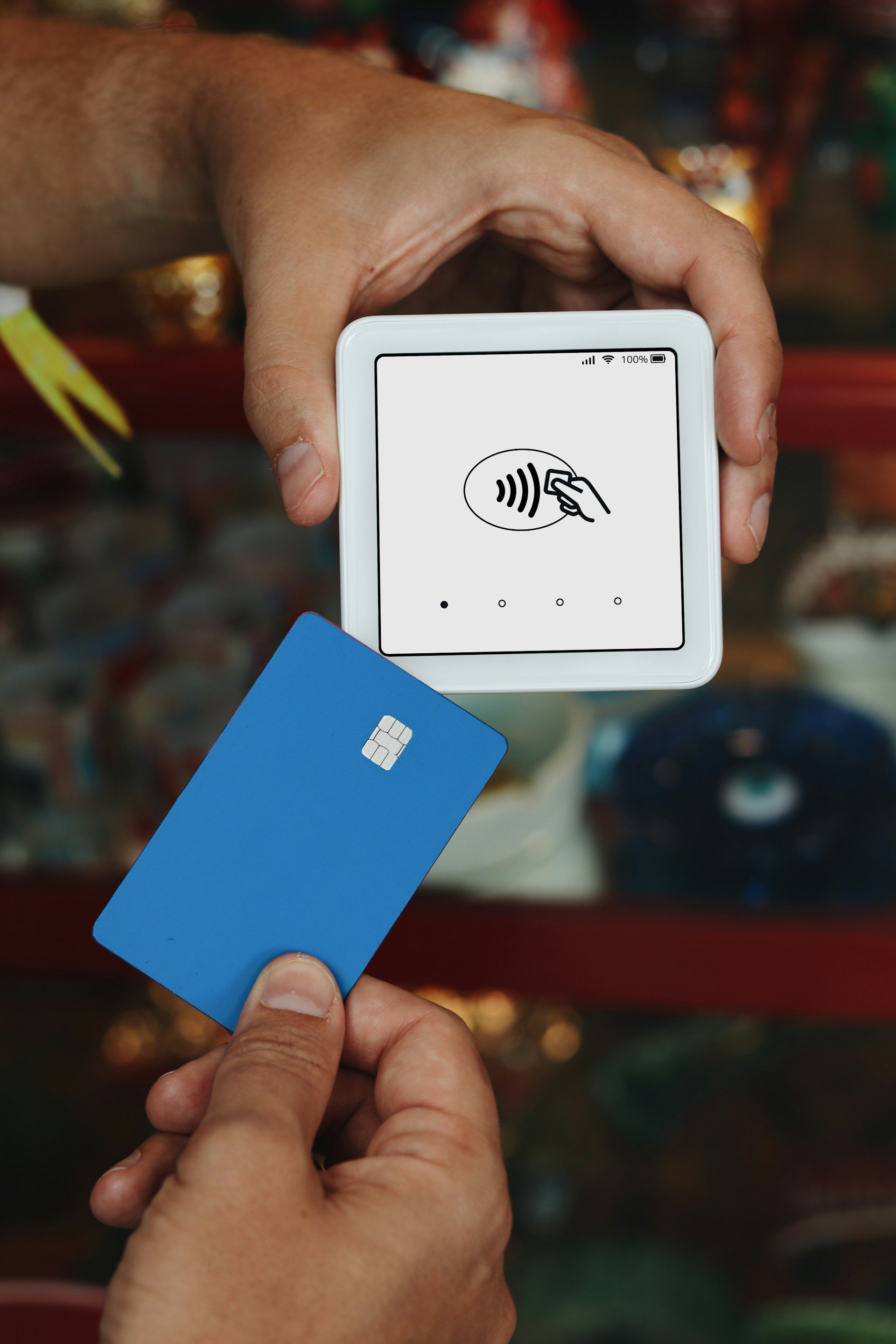 A person holding a credit card in their hand
