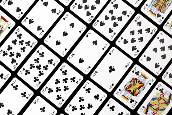 A spread of playing cards in a graphic arrangement