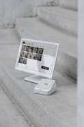 A computer monitor sitting on top of a set of stairs