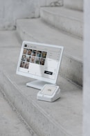 A computer monitor sitting on top of a set of stairs
