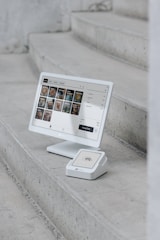 A computer monitor sitting on top of a set of stairs