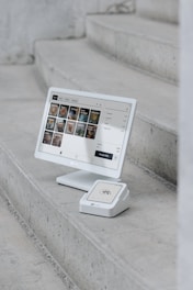 A computer monitor sitting on top of a set of stairs