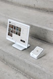 A computer monitor sitting on top of a set of stairs
