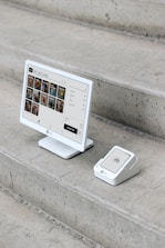 A computer monitor sitting on top of a set of stairs
