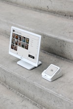 A computer monitor sitting on top of a set of stairs