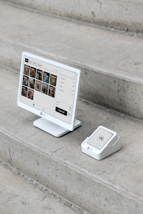 A computer monitor sitting on top of a set of stairs