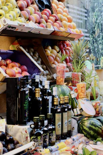 A fruit stand with a variety of fruits and condiments