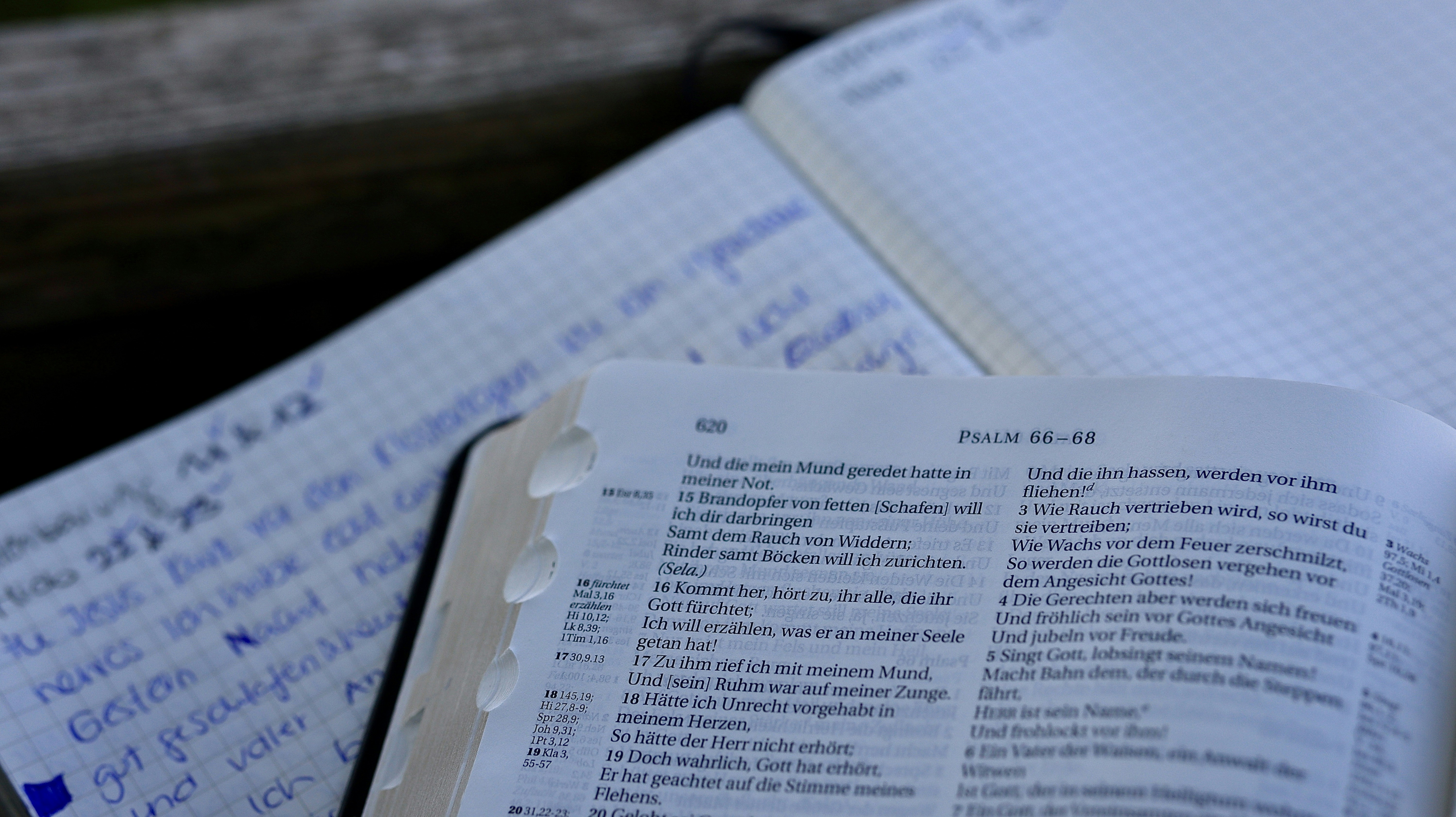 An open book sitting on top of a wooden table