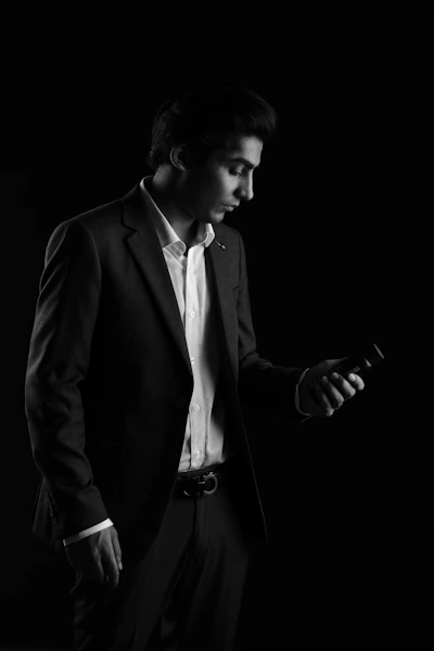 A black and white photo of a man in a suit