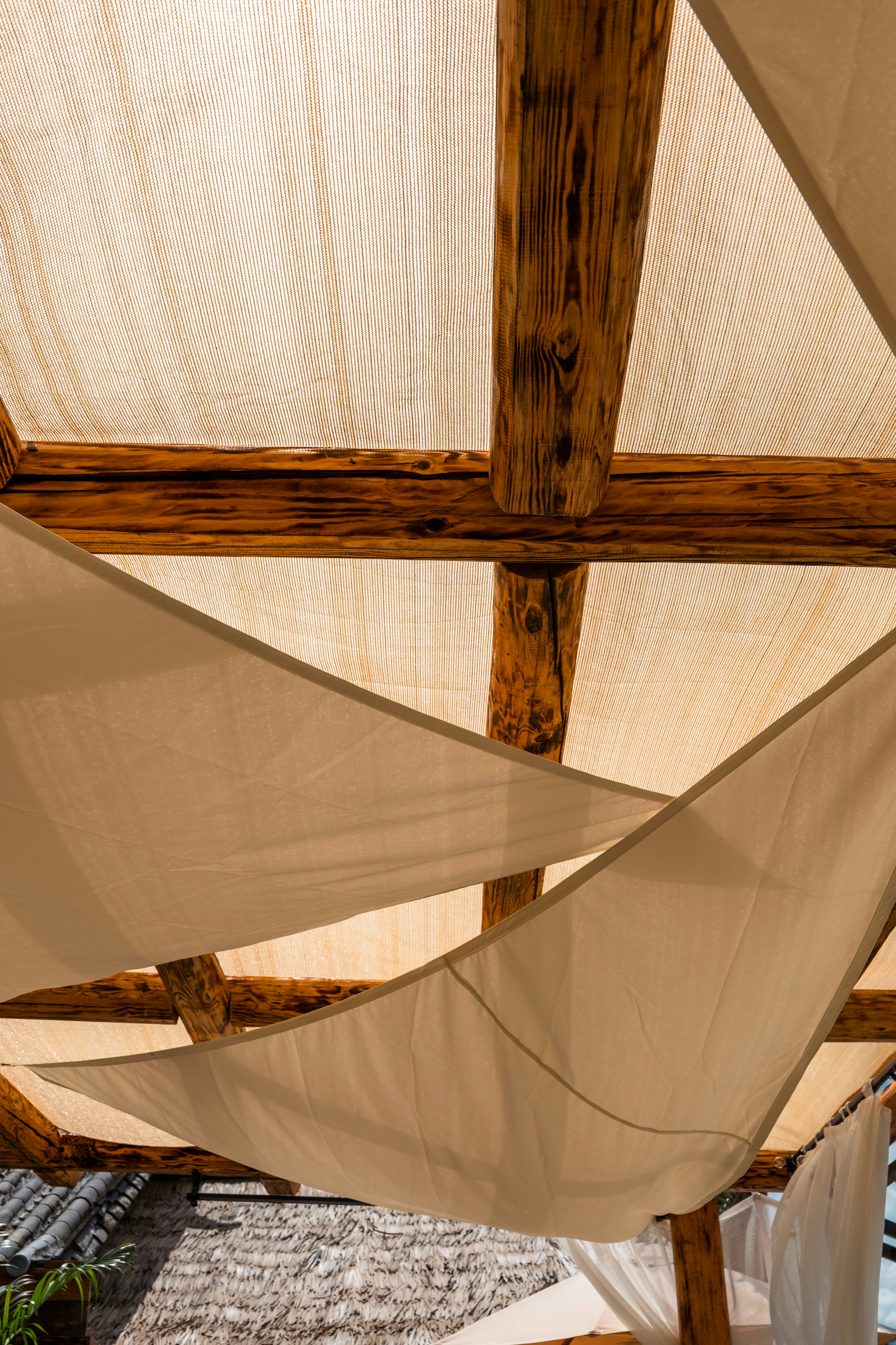 Light beige tropical suiting fabric with open weave texture in an airy bright textile setting