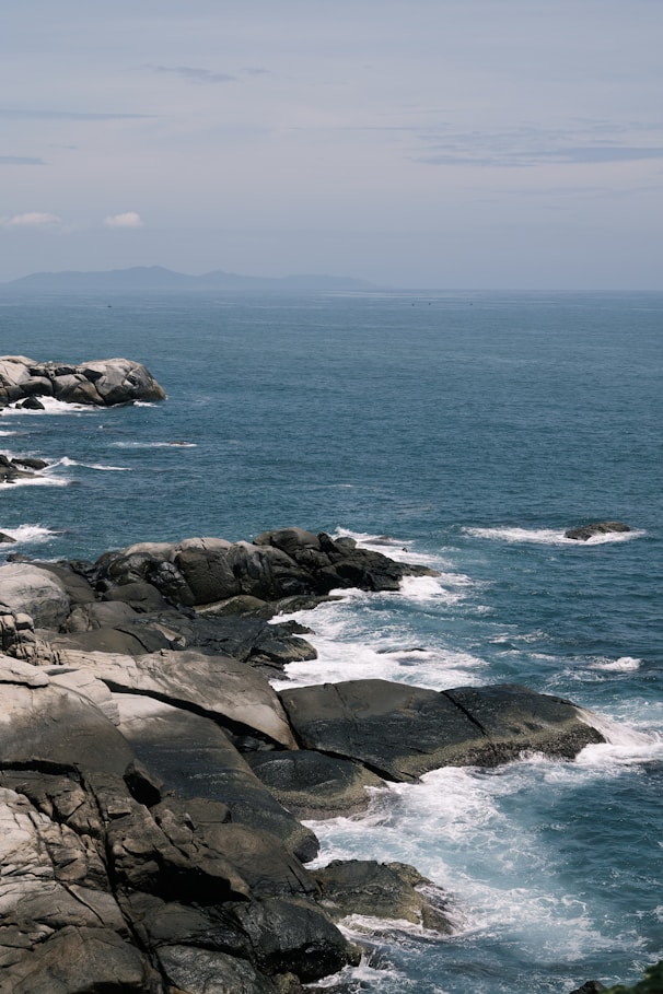 A view of the ocean from a rocky cliff