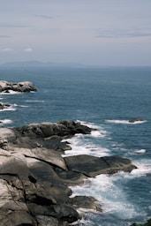 A view of the ocean from a rocky cliff