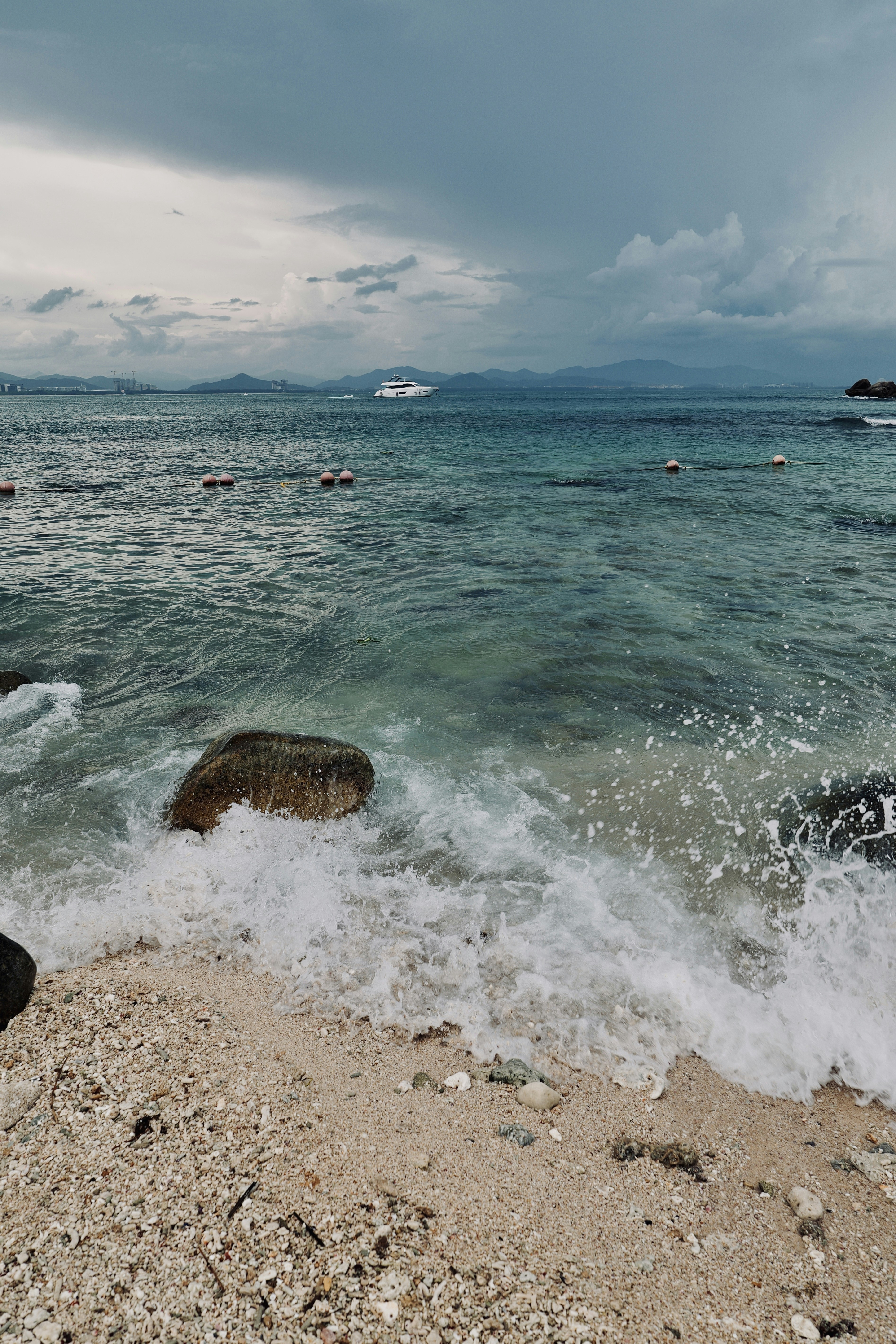 A body of water sitting next to a sandy beach