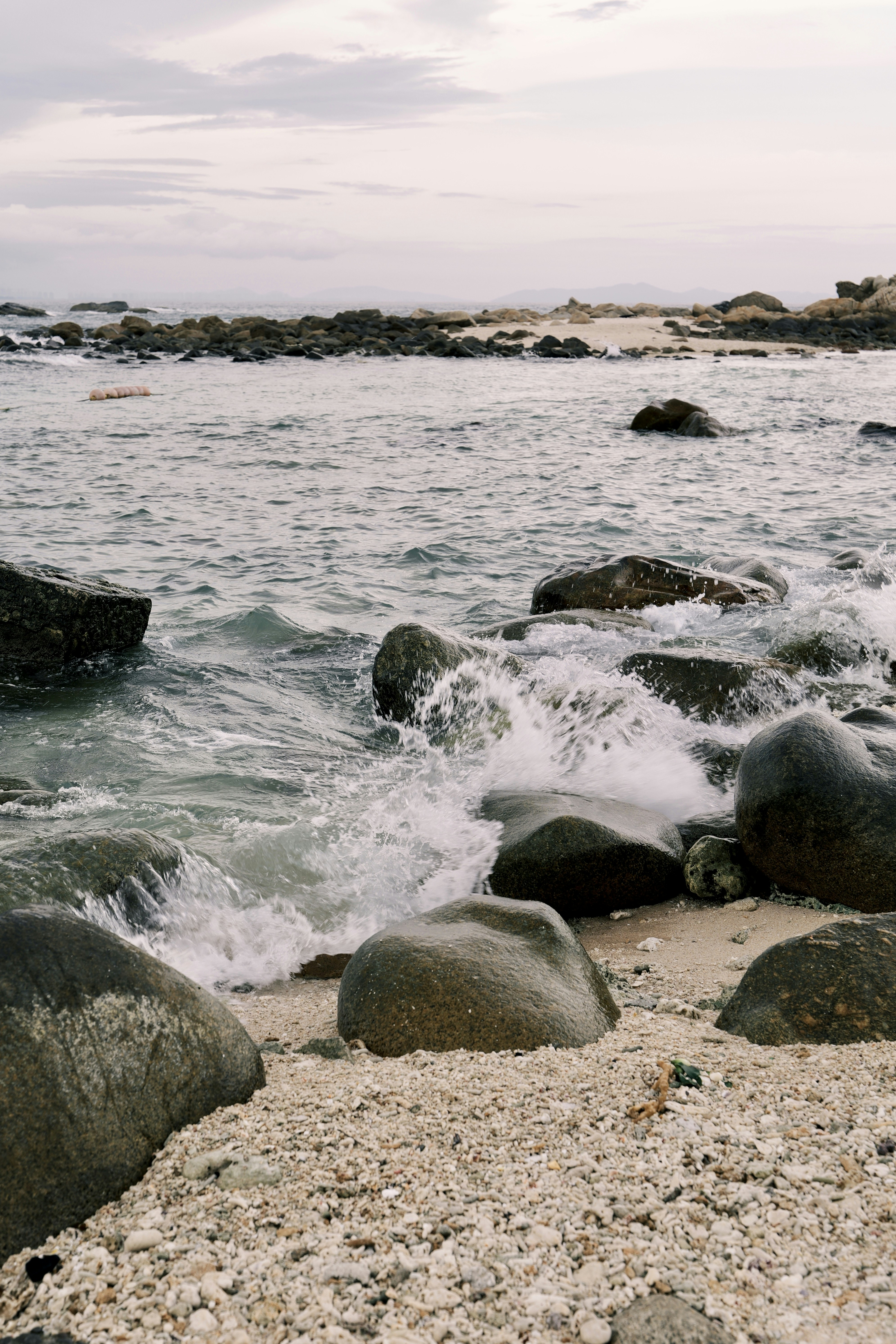 A bunch of rocks that are in the water